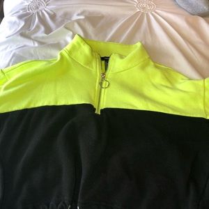 A black and neon green crop top